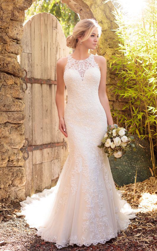 a trumpet lace halter neckline wedding dress with an illusion sweteheart neckline and a train