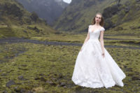 04 An off the shoulder wedding gown with textural lace and A-line looks princess-like