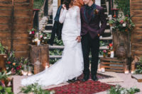 04 The groom was rocking a burgundy suit with black, the bride was wearing a lace wedding dress with an illusion neckline and long sleeves