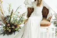 04 The second wedding dress was a beaded one with bell sleeves and a train and an illution neckline, so beautiful
