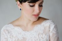 04 a pixie hairstyle with a fresh floral and greenery headband plus sapphire earrings for a statement