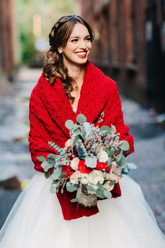 A red knit coverup and a red lip makes this bridal look bold and very eye catchy