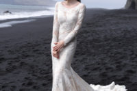05 A lace scoop neckline wedding dress with a small train and long sleeves looks very romantic