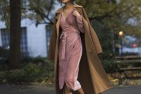 05 a pink wrap velvet dress with long sleeves and a V-neckline, black heels and a mustard trench