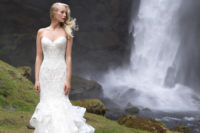06 A strapless sweetheart neckline mermaid wedding gown of textural lace and with a ruffled tail and train