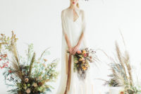 06 The third wedding gown was a modern V-neckline one with an ethereal cape over it for an airy feel