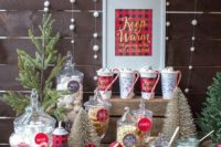 06 a chic hot chocolate bar with desserts, a sign, a faux Christmas tree and lots of plaid for a Christmas wedding