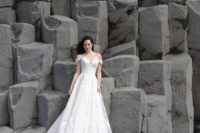 07 A gorgeous off the shoulder lace wedding dress with a small train looks very romantic