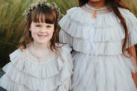 07 The flower girls were wearing ruffled dresses and floral crowns