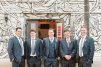 07 The groom was wearing a three-piece suit with a grey tie, and the groomsmen opted for single-breast suits in the same color