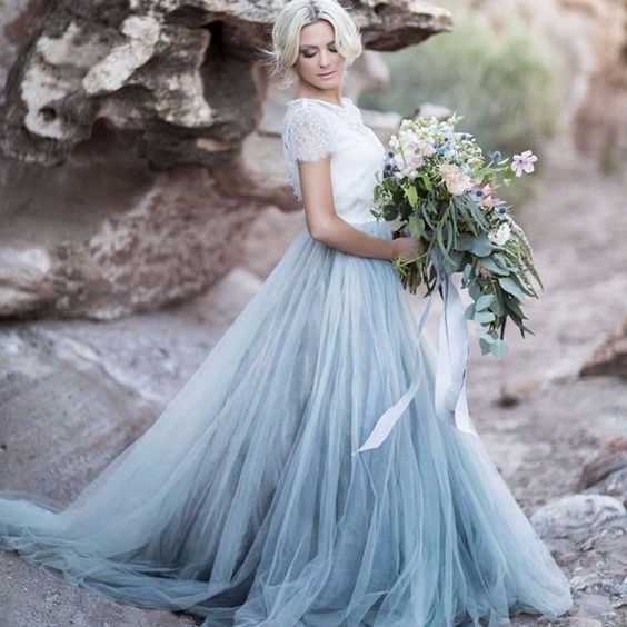 a trendy bridal separate with a white lace top and a blue tulle skirt looks heavenly beautiful
