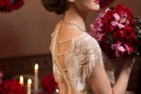 07 gorgeous pearl and fringe detailing on the back and shoulder of the dress, pearl studs and a birdcage veil make her look wow