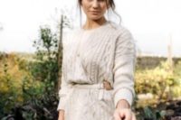 07 make a gorgeous braided updo, cover up with a neutral cable knit sweater and a belt to look gorgeous and feel comfy