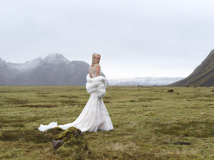 Mermaid lace wedding dress with an illusion back, no sleeves, a train and a gorgeous faux fur coverup