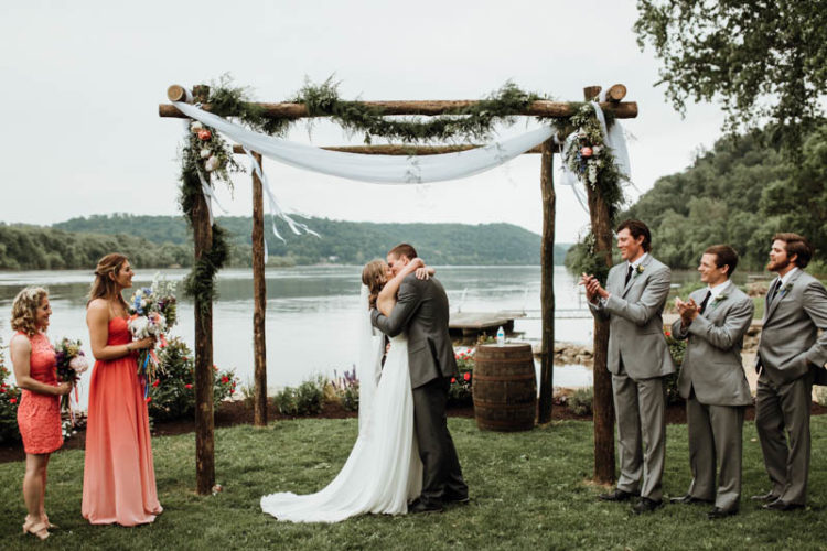 The wedding arch was done of wood, greenery, flowy fabric and blooms, the space looked peaceful and quiet