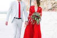 08 a red wedding dress with a lace bodice and long sleeves and a matching tie for the groom