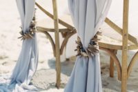 08 pale blue fabric with shell and driftwood pieces for a coastal wedding