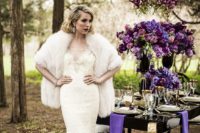09 a lace and bead wedding dress with a V-neckline, a faux fur shawl and statement earrings for a glam look