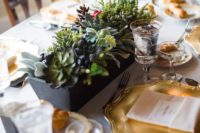 09 a lush centerpiece with succulents, foliage and privet berries plus a calligraphy table number