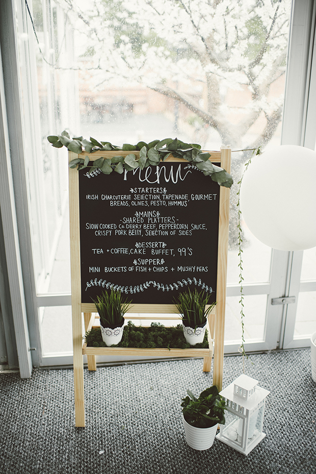 Such a cute chalkboard sign with moss and greenery is a great idea for any wedding