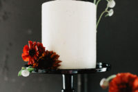 10 The wedding cake was a white one, with bold burnt orange blooms on top
