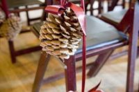 10 large snowy pinecones on a pink ribbon will be amazing aisle decorations