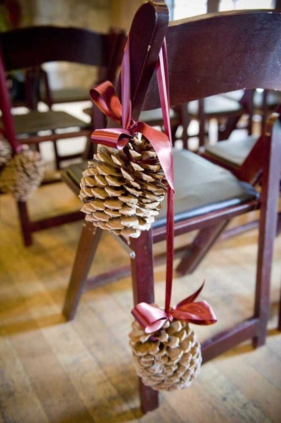 large snowy pinecones on a pink ribbon will be amazing aisle decorations
