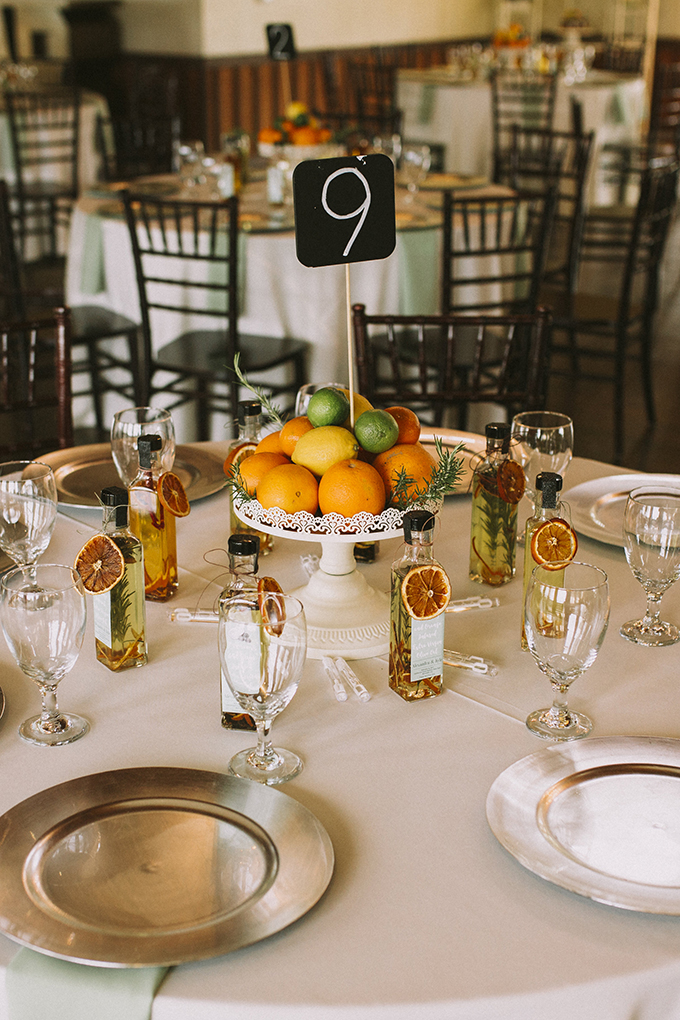 The table decor was done with vintage stands and citrus and citrus flavored oil was given as favors