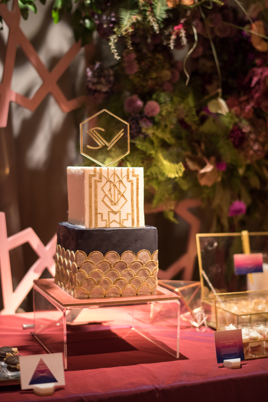 The wedding cake was art deco, a square one with gold art deco details and an acrylic topper