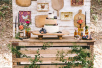 13 Instead of a wedding cake, the stylists decided on cheese wheels with grapes and figs