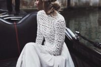 13 a chic wedding dress with a boho lace bodice with a turtleneck and a pleated skirt to feel comfy