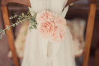 13 a layered tulle chair cover with peachy blooms and a touche of greenery for a rustic wedding