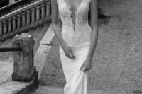 13 a plunging neckline wedding dress with no sleeves of lace with a textural bodice