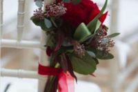 13 decorate the aisle with greenery and crimson roses with ribbons