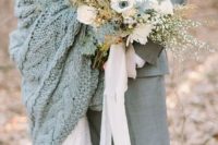 14 a large cable knit grey coverup matches the groom’s suit and keeps the bride warm