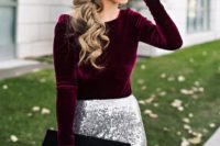 14 a plum-colored velvet long sleeve shirt, a silver sequin maxi skirt, a black suede and leather clutch