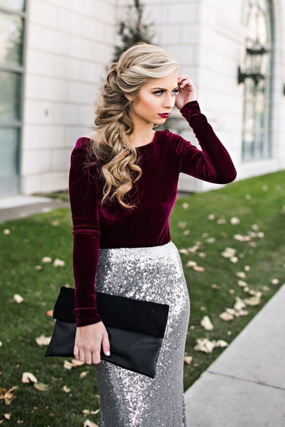a plum colored velvet long sleeve shirt, a silver sequin maxi skirt, a black suede and leather clutch