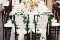 14 airy white fabric and foliage garlands for decorating wedding chairs is a great idea for most wedding styles
