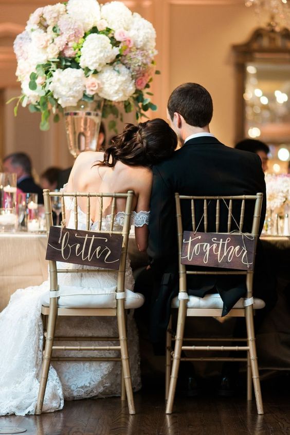 dark stained signs with calligraphy are great for accentuating your wedding chairs