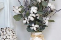 15 a cozy arrangement with cotton, eucalyptus and lavender is ideal for a rustic wedding