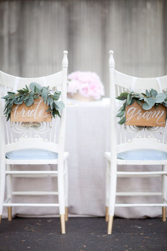 cute wooden signs with fresh eucalyptus are a chic idea for any wedding