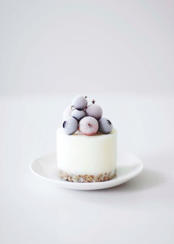 mini frozen yogurt cake with frozen berries on top reminds of the frosty winter days