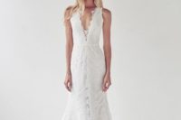 16 a lace plunging neckline wedding dress with a small train and a lace edge