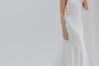 17 a modern halter neckline wedding dress with straps and a train looks very chic