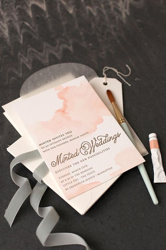 watercolor pastel pink wedding invitations in simple white envelopes