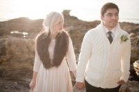 18 the groom wearing a white cable knit cardigan instead of a jacket
