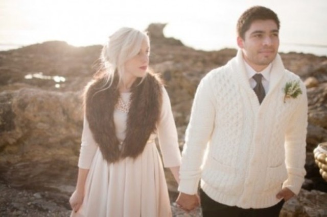 the groom wearing a white cable knit cardigan instead of a jacket