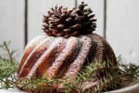 19 a bundt cake topped with pinecones and evergreens is a great idea to make your dessert table variable
