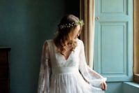 19 a lace wedding dress with bell sleeves, a V-neckline and a lace skirt for a romantic countryside bride