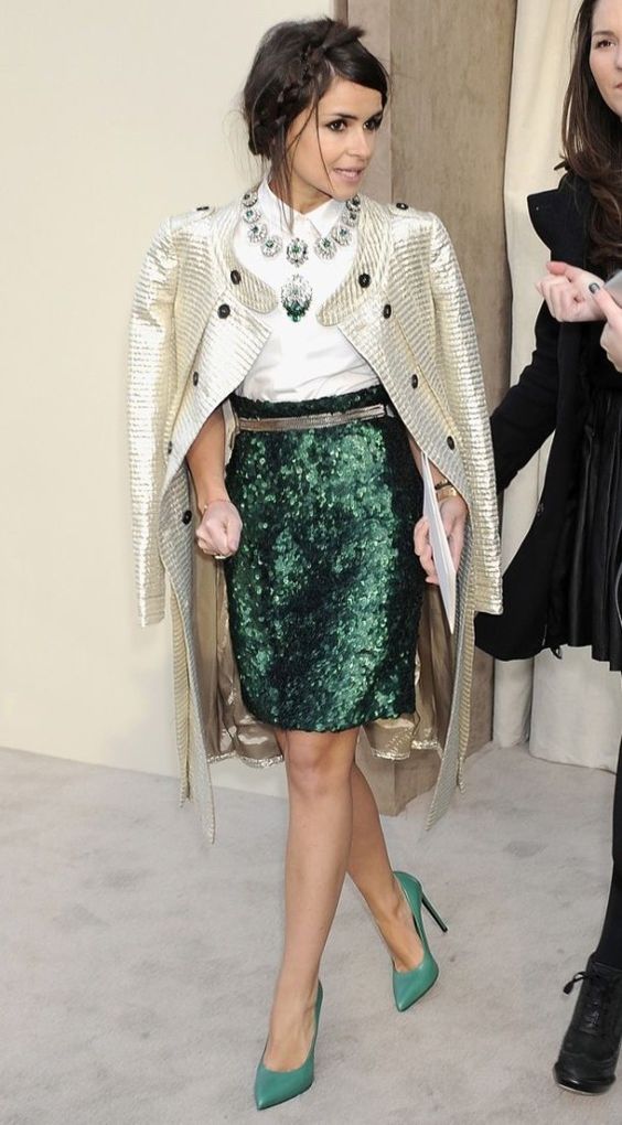a white shirt, an emerald sequin knee skirt, green heels, a statement necklace and a sparkly coat as a cover up